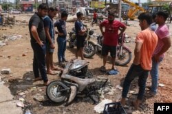 Residents look at a motorbike that was charred during a riot between Muslim and Hindu groups in Sohna, near New Delhi, Indian capital, August 1, 2023. (Photo: Vinay Gupta/AFP)