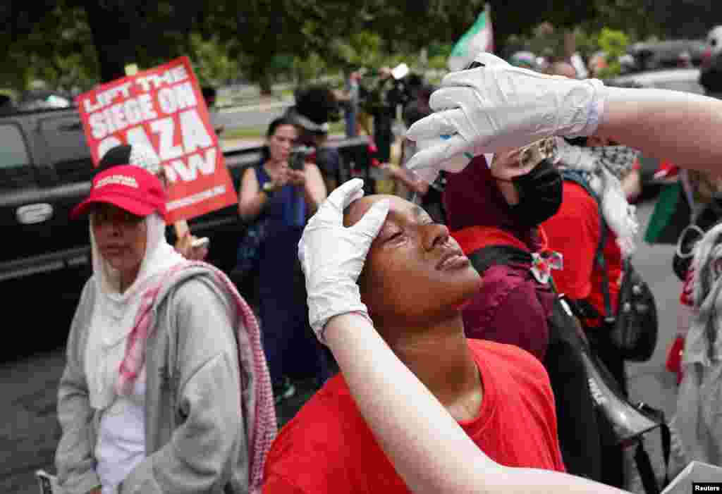 A protester has their eyes washed after police used pepper spray on pro-Palestinian demonstrators, on the day of Israeli Prime Minister Benjamin Netanyahu's address to a joint meeting of Congress, on Capitol Hill in Washington, July 24, 2024. 