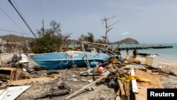 Scattered debris clutters the waterfront after Hurricane Beryl passed the island of Carriacou, Grenada, July 2, 2024. 