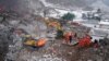 Petugas SAR mencari korban hilang di lokasi bencana, sehari setelah tanah longsor melanda Desa Liangshui di Zhaotong, di Provinsi Yunnan, China barat daya pada 23 Januari 2024. (Foto: CNS/AFP)