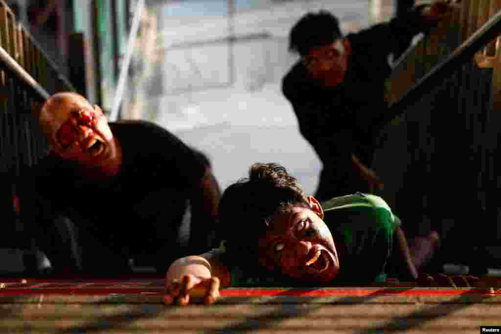 People perform as zombies during the &#39;Train to Apocalypse: No Way Out&#39; event, held to entertain commuters and attract people to use Light Rail Transit (LRT) train, in Jakarta, Indonesia.