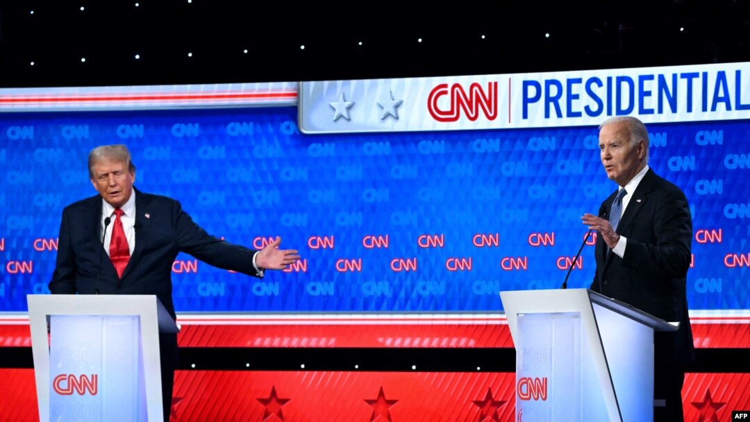 US President Joe Biden and former US President and Republican presidential candidate Donald Trump participate in the first presidential debate of the 2024 elections at CNN's studios in Atlanta, June 27, 2024.