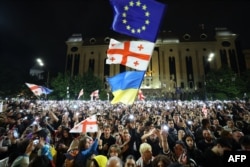 Protesters rally against the "foreign influence" law outside the parliament in Tbilisi on May 15, 2024.