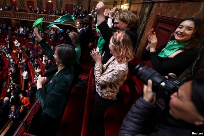 MPs and senators react after a vote to anchor the right to abortion in the country's constitution in Versailles, southwestern of Paris, France, March 4, 2024.