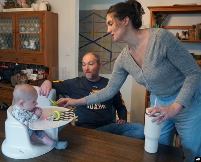 FILE - Mike and Jane Roberts tend to their son, Dennis, at their Pocatello, Idaho, home on March 1, 2024.