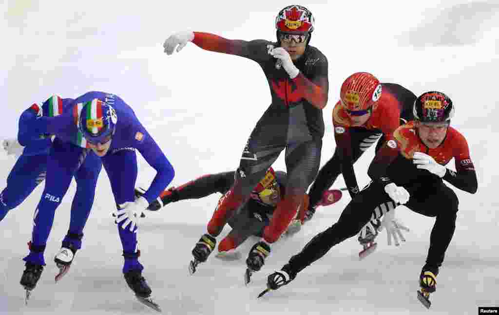 Canada&#39;s Maxime Laoun falls during the men&#39;s 5000m relay final at the ISU Short Track Speed Skating Championships in Seoul, South Korea.