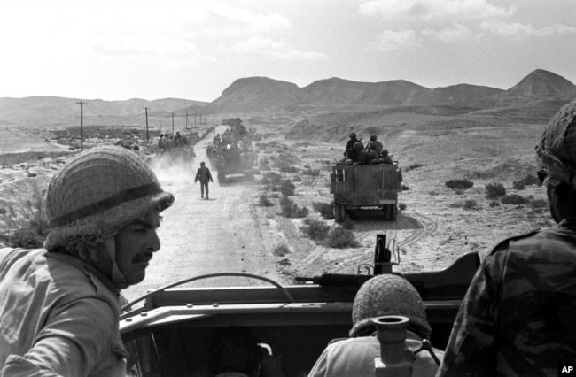 FILE - In this June 7, 1967 file photo, Israeli troops advance through Sinai, Egypt during the Six-Day War. (AP Photo, File)