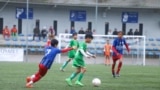 Anusak is playing football while competing in a football match with the other team team