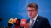 FILE - Latvia's Foreign Minister Edgars Rinkevics talks to journalists during the meeting of NATO Ministers of Foreign Affairs, in Bucharest, Romania, Nov. 30, 2022. 