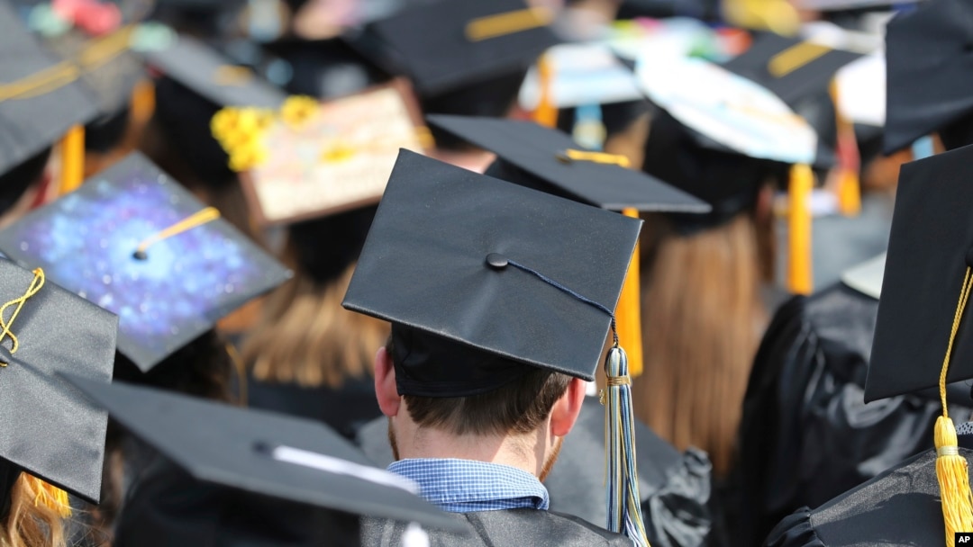 FILE - Graduates at the University of Toledo commencement ceremony in Toledo, Ohio, May 5, 2018. 