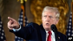 Republican presidential nominee former President Donald Trump speaks to reporters during a news conference at his Mar-a-Lago estate Aug. 8, 2024, in Palm Beach, Fla. 