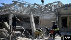 Members of Ukraine's emergency services conduct a search and rescue operation at the site where a hotel was hit by a missile in Kramatorsk, in Ukraine's Donetsk region, Aug. 25, 2024.