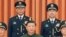 Chinese President Xi Jinping, center, poses for a photo with the new commander of China's rocket force Gen. Wang Houbin, top left, and its political commissar Gen. Xu Xisheng, top right, in Beijing, July 31, 2023. (Li Gang/Xinhua via AP)