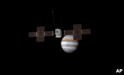 This image provided by the European Space Agency depicts the Jupiter Icy Moons Explorer, Juice, spacecraft orbiting the gas giant.