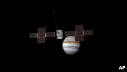 This image provided by the European Space Agency depicts the Jupiter Icy Moons Explorer, Juice, spacecraft orbiting the gas giant.