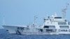 A Chinese coast guard ship with bow number 5201 blocks Philippine coast guard ship BRP Malapascua as it maneuvers to enter the mouth of the Second Thomas Shoal, locally known as Ayungin Shoal, at the South China Sea, April 23, 2023.