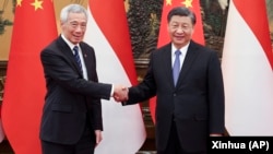 资料照片: 中国领导人习近平在北京会晤到访的新加坡总理李显龙（2023年3月31日）