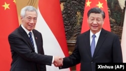 中国领导人习近平在北京会晤到访的新加坡总理李显龙。（2023年3月31日）