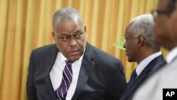FILE - New Haitian Prime Minister Garry Conille, left, is seen during his swearing-in ceremony in Port-au-Prince, Haiti, June 3, 2024.