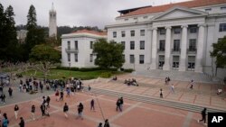 FILE - Students walk through Sproul Plaza on the University of California, Berkeley campus on March 29, 2022, in Berkeley, California.