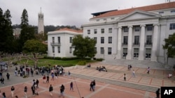 FILE - Students walk through Sproul Plaza on the University of California, Berkeley, campus on March 29, 2022, in Berkeley, California.