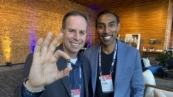 Alex Luebke, Vivek Kumbhari and the PillBot are pictured at the TED Conference in Vancouver, British Columbia, which was held April 15-19, 2024. (Craig McCulloch/VOA)