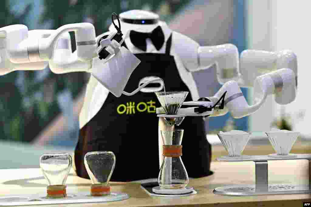 A robot makes coffee during the World Intelligence Expo in Tianjin, China.