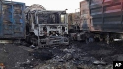 In this photo provided by the Odesa Regional Prosecutor's Office, burnt trucks are seen in Odesa, Ukraine, Sept. 13, 2023, following Russian drone attacks. New drone attacks were reported in Ukraine's Odesa and Mykolayiv regions Monday.