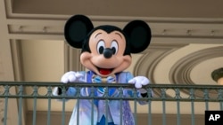 FILE - An actor dresses as Mickey Mouse at Walt Disney World Resort, April 18, 2022, in Florida. The earliest version of Disney's most famous character will become public domain on Jan. 1, 2024. (AP Photo/Ted Shaffrey, File)