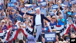 Democratic vice presidential nominee Minnesota Governor Tim Walz arrives to deliver remarks before Democratic presidential nominee Vice President Kamala Harris in Eau Claire, Wisconsin, Aug. 7, 2024.