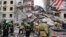 This photo released by Belgorod regional Governor Vyacheslav Gladkov on social media May 12, 2024, shows Russian emergency workers outside a partly collapsed block of flats after a Ukrainian missile attack, in Belgorod city. 