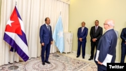 Somali President Hassan Sheikh Mohamud, left, receives credentials from Cuba’s ambassador to Somalia, Juan Manuel Rodriguez, in a photo posted on Twitter April 4, 2023, by @TheVillaSomalia, Mohamud's official Twitter account.