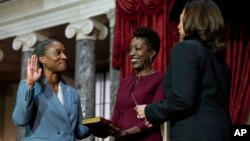 FILE - Vice President Kamala Harris, right, swears in Laphonza Butler, D-Calif., left, to the Senate to succeed the late Sen. Dianne Feinstein during a re-enactment of the swearing-in ceremony, Oct. 3, 2023, on Capitol Hill in Washington.