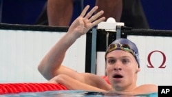 Leon Marchand of France, celebrates after winning the men's 200-meter individual medley final at the 2024 Summer Olympics, Aug. 2, 2024, in Nanterre, France. 