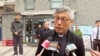 Hong Kong Bishop Stephen Chow talks to media during his visit to Beijing, April 20, 2023, in this image from a video shot by Hong Kong broadcaster TVB.