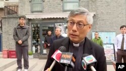 Hong Kong Bishop Stephen Chow talks to media during his visit to Beijing, April 20, 2023, in this image from a video shot by Hong Kong broadcaster TVB.