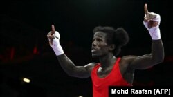 David de Pina, pugilista cabo-verdiano celebra vitória sobre o tailandês Thitisan Panmot, 30 julho 2024 (Foto MOHD RASFAN / AFP)