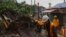 Workers clear debris near shophouses after Typhoon Saola struck the city with strong winds and rain, in Hong Kong, Sept. 2, 2023. 