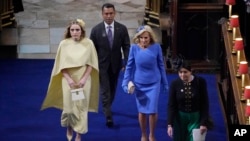 U.S. first lady Jill Biden, and her granddaughter Finnegan arrive at Westminster Abbey, for the coronation of King Charles III and Camilla, the Queen Consort, in London, May 6, 2023.