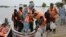 Rescue workers evacuate villagers through a boat from a flooded area of Pakpattan district of Pakistan's Punjab province, Aug. 23, 2023. 