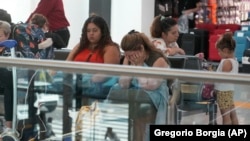 Passengers crowd the international flights departure area of Rome's Fiumicino airport, July 19, 2024. Many flights were delayed or canceled due to the worldwide internet outage. This unexpected event caused many trips to "go south." (AP Photo/Gregorio Borgia)