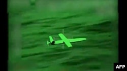 FILE - This handout screengrab of a video taken and released by the French 'Etat-Major des Armees' on March 20, 2024, shows a Houthi UAV threatening commercial navigation in the Red Sea. 