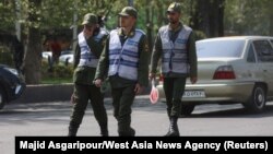 Iran's police forces walk on a street amid the implementation of the new hijab surveillance in Tehran, Iran, April 15, 2023. (Majid Asgaripour/West Asia News Agency via Reuters)