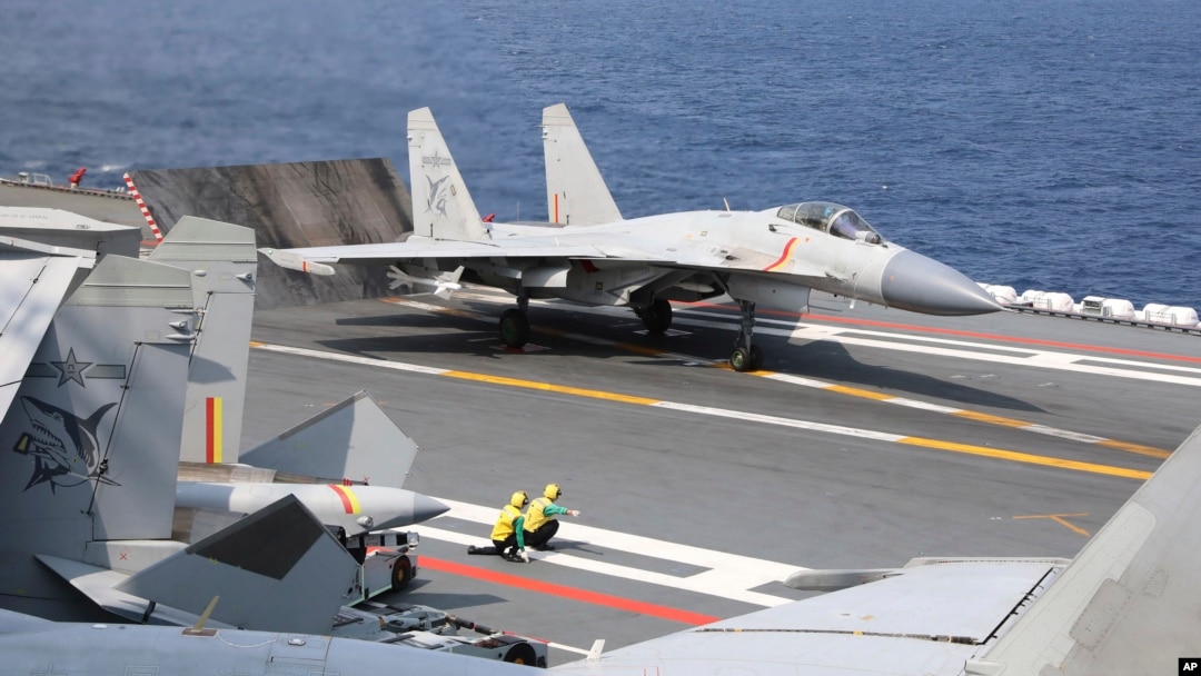 FILE - In this photo released by Xinhua News Agency, a J-15 Chinese fighter jet prepares to take off from an aircraft carrier during military exercises around the Taiwan Island by the Chinese People's Liberation Army, April 9, 2023. 
