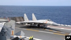 FILE—In this photo released by Xinhua News Agency, a J-15 Chinese fighter jet prepares to take off from an aircraft carrier around Taiwan by the Chinese People's Liberation Army, April 9, 2023.