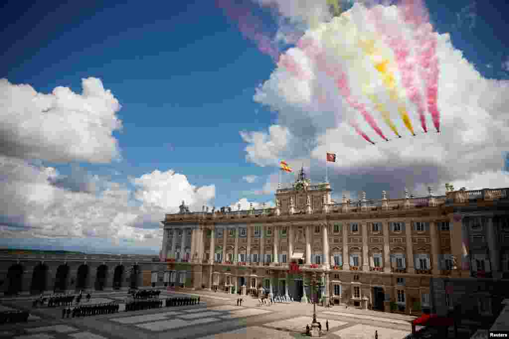 The aerobatic team &quot;Patrulla Aguila&quot; (Eagle Patrol) of the Spanish Air and Space Force flies past the Royal Palace during commemorations marking the 10th anniversary of the proclamation of Spain&#39;s King Felipe VI, in Madrid.