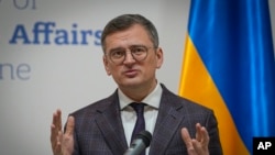 FILE - Ukraine's Foreign Minister Dmytro Kuleba attends a joint news conference with Moldova's Foreign Minister Mihai Popsoi in Kyiv, Ukraine, March 13, 2024.