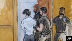 In this sketch from federal court in New York, Aug. 11, 2023, officers escort FTX founder Sam Bankman-Fried from the room. A judge revoked his bail after concluding that the fallen cryptocurrency whiz had tried to influence witnesses against him.