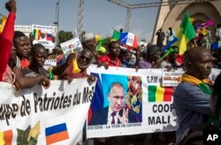 FILE - Malians demonstrate against France and in support of Russia in Bamako, Mali, on Sept. 22, 2020. Russia's Wagner Group, a private military company, deployed its personnel to several African countries.