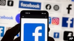 FILE - The Facebook logo is seen on a cell phone, on Oct. 14, 2022. 